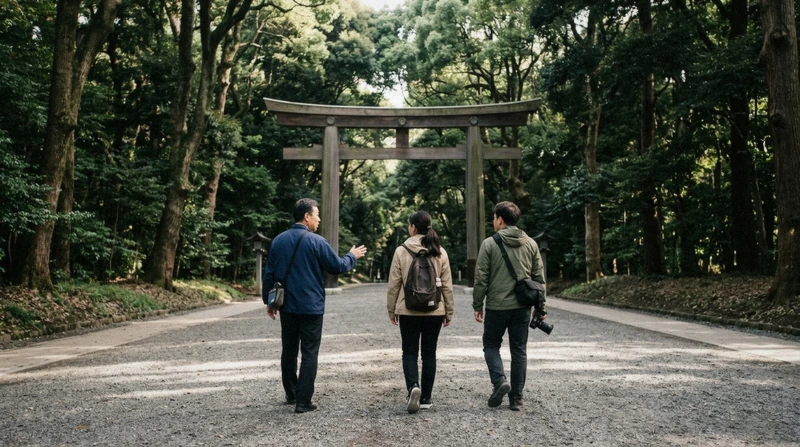 Local guide leading two travellers along the approach to Meiji Shrine on a private walking Tokyo city tour